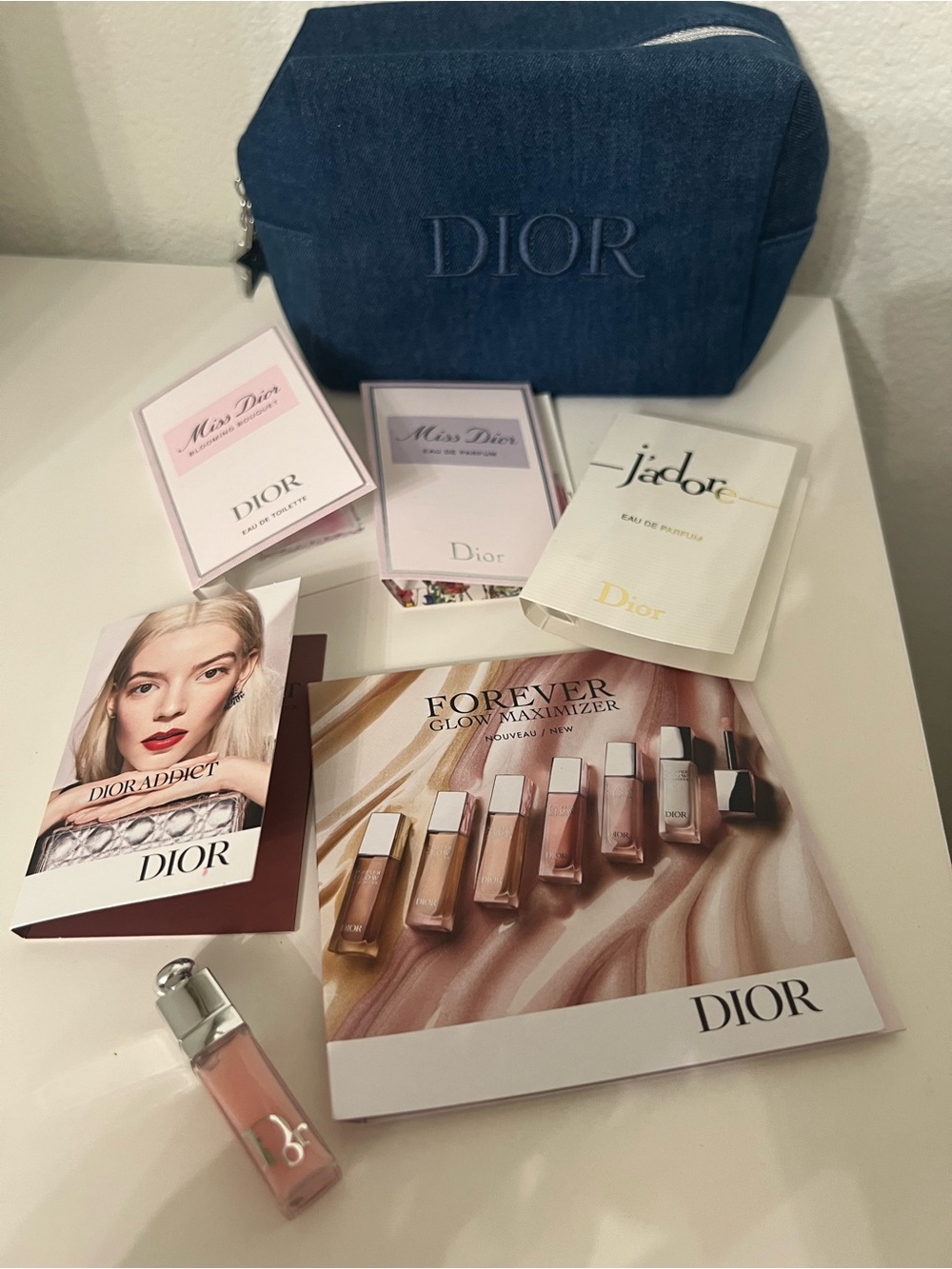 Dior New denim Embroidered Logo makeup Bag with Dior mini samples.